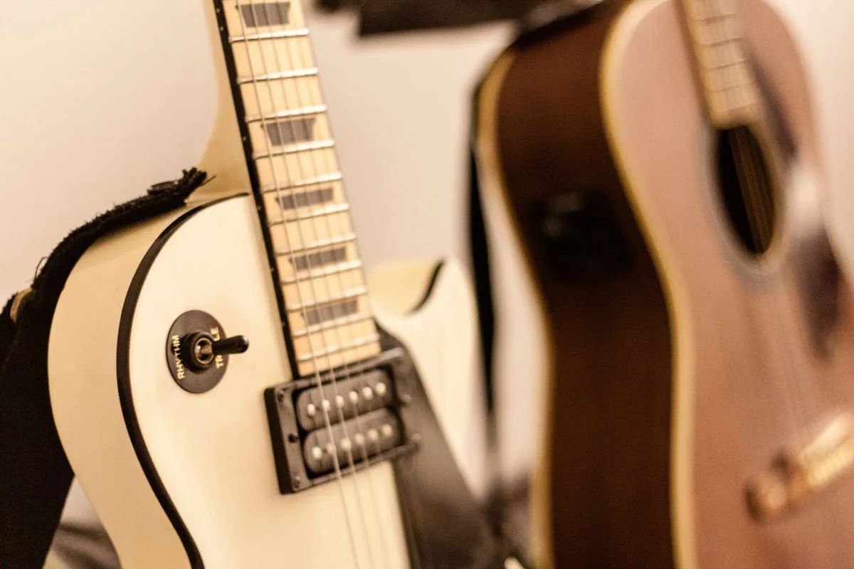 A close-up of acoustic and electric guitars