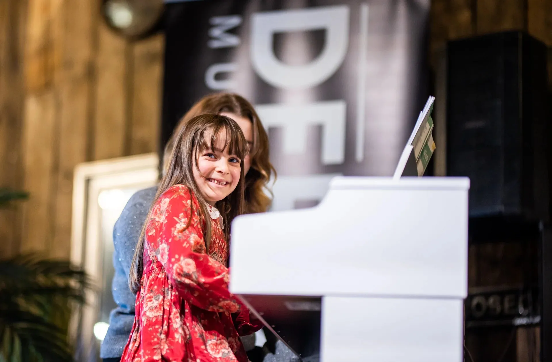 Student enjoying a piano lesson